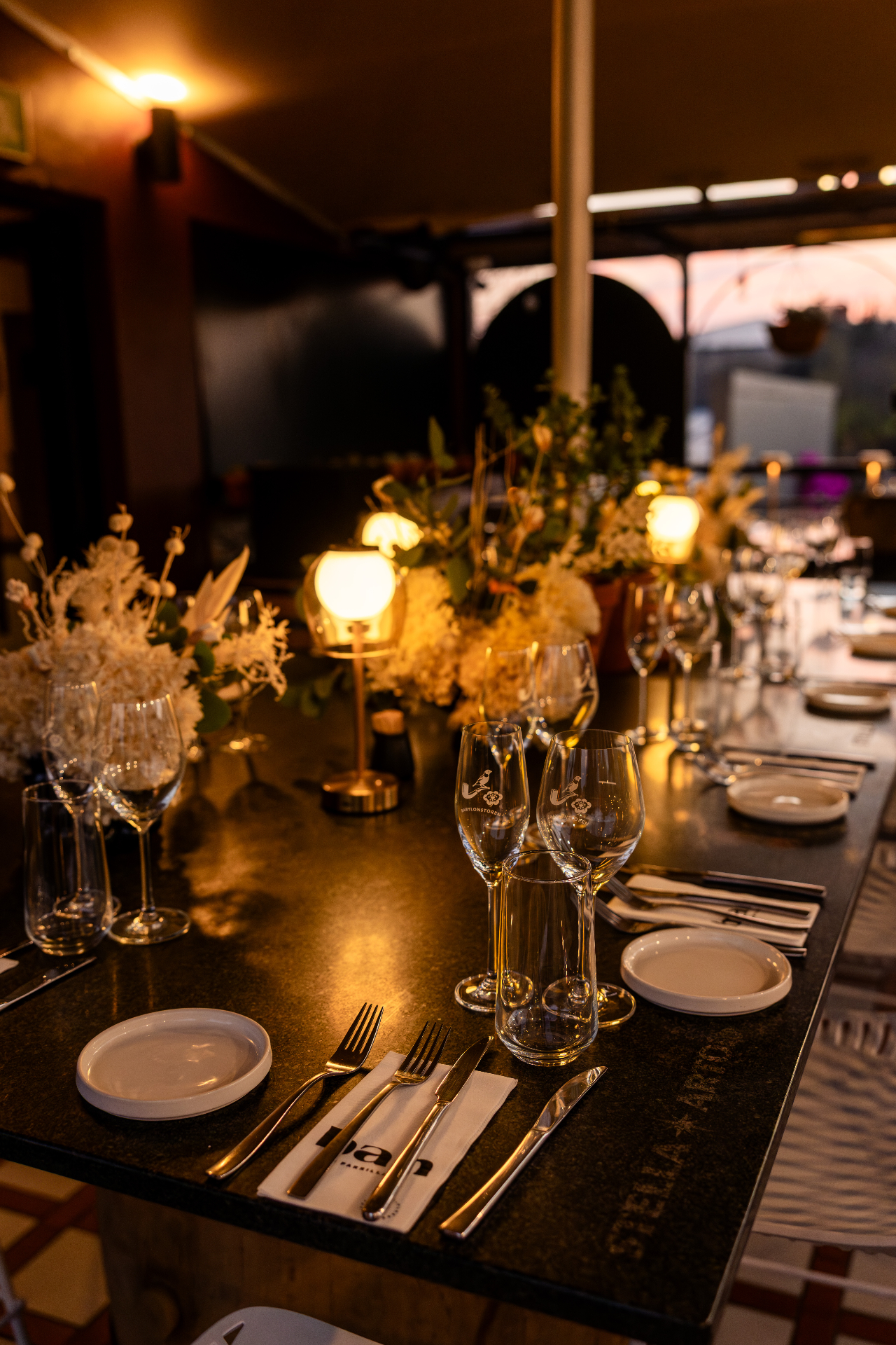 The Terrace at BAH — candlelit rooftop table set for an evening event